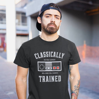 Guy wearing gaming tee with NES controller vector art, and text saying 'Classically Trained, Retro Gamer, 80s and 90s Games'.
