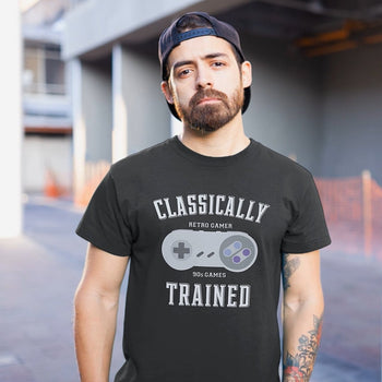 Guy wearing gaming t-shirt with SNES controller vector art, and text saying 'Classically Trained, Retro Gamer, 90s Games'.