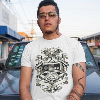 Man wearing gaming t-shirt with patterns and NES elements such as 4 zapper guns, 1 controller, 2 consoles, 2 cartridges.