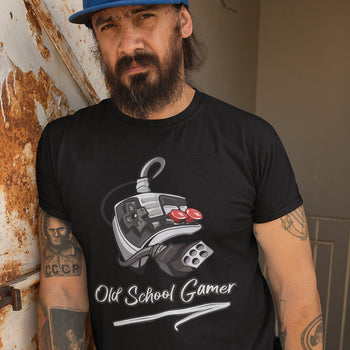 Man wearing retrogaming t-shirt that says 'Old School Gamer', with an artistic illustration of an NES controller.