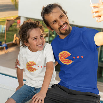 Father and son wearing cute gaming t-shirts of a retro pixelated pepperoni pizza, shaped like Pac-Man, and pepperoni as dots.