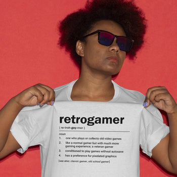 Guy wearing funny retrogaming t-shirt that gives several amusing definitions of a 'Retrogamer' in dictionary style design.