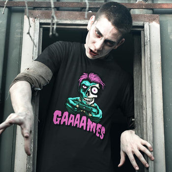 Guy wearing funny horror gaming t-shirt depicting a zombie holding game controller and murmuring 'GAAAAMES'.