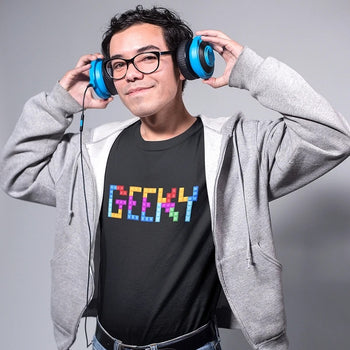 Guy wearing gaming t-shirt with the word 'GEEKY' that is made up of tetris blocks.